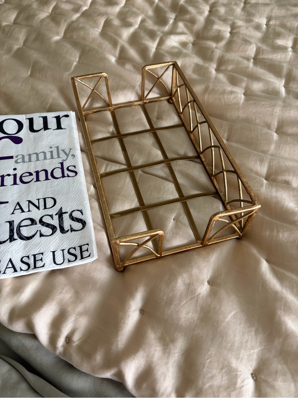 Gold tone metal guest towel holder